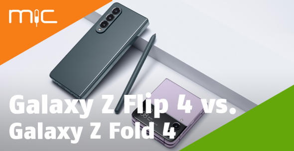 Graues Galaxy Z Flip 4 mit Stift und violettes Galaxy Z Fold 4 liegen nebeneinander auf weißem Untergrund.